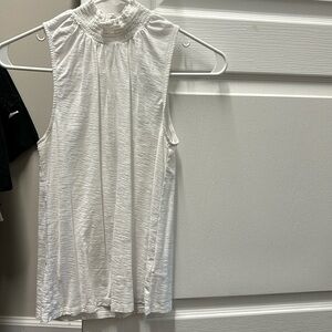 Nation, LTD sleeveless white tee with decorative snaps and smocked neck.